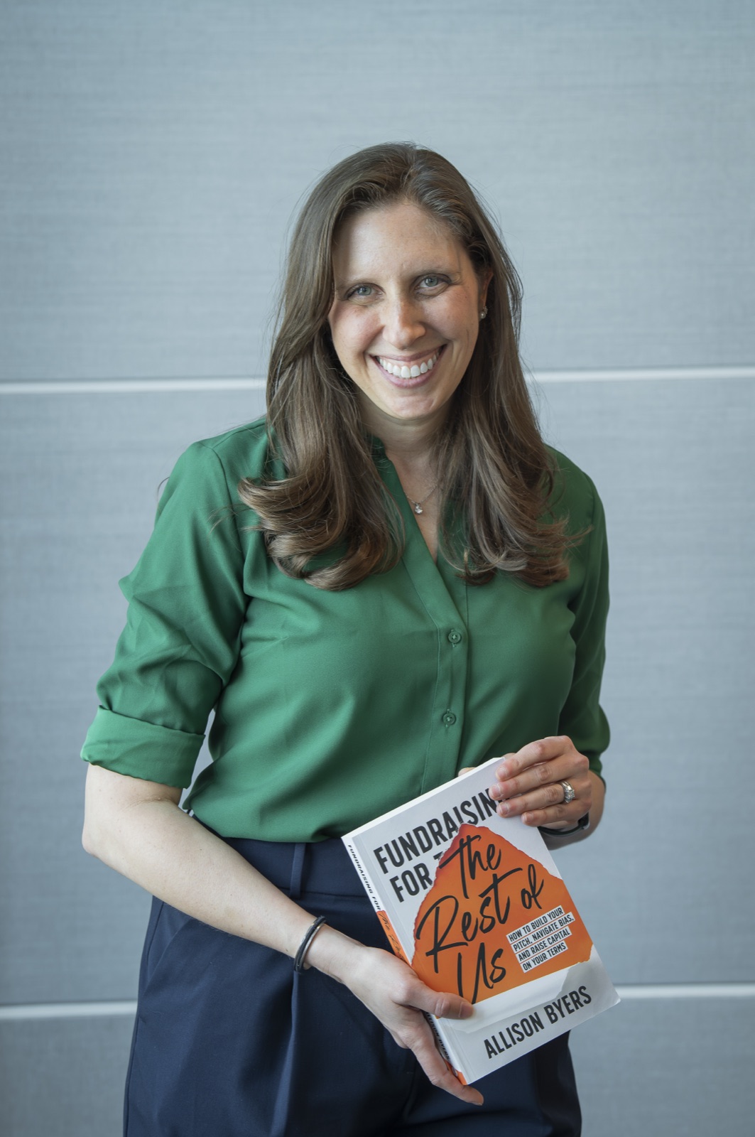 Allison Byers holding her book